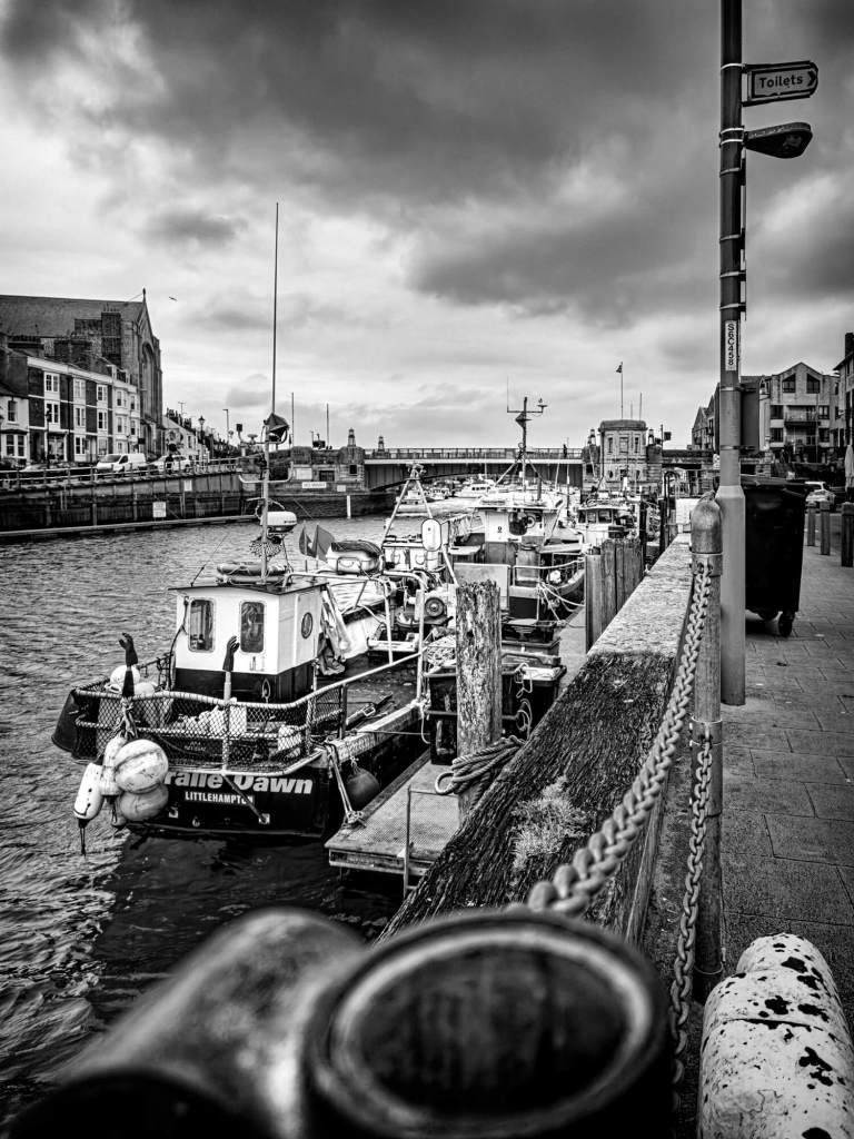 Photograph of fishing boats in Weymouth harbour.